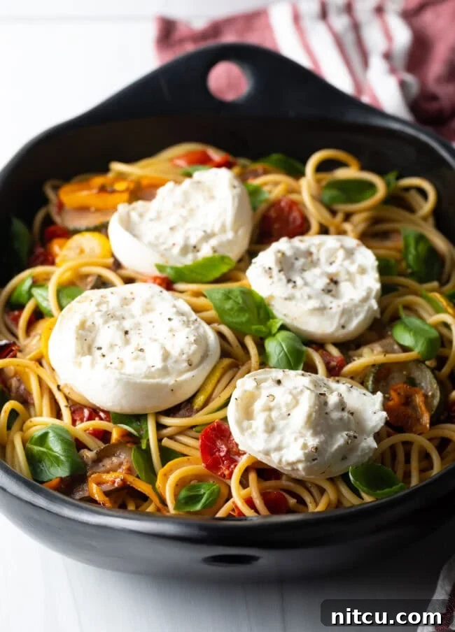 Creamy Burrata and Roasted Summer Harvest Pasta 2 Spaghetti with veggies and creamy burrata cheese.