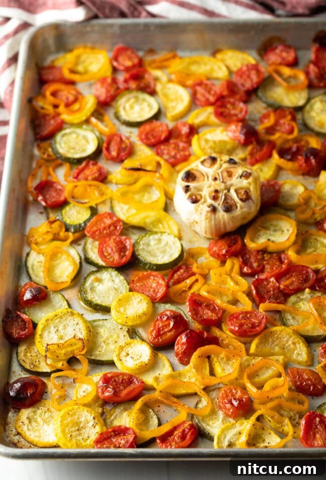 Creamy Burrata and Roasted Summer Harvest Pasta 6 Roasted summer vegetables on a sheet pan after the first roasting phase.