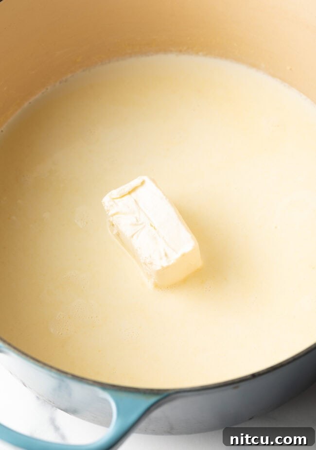Decadent Shrimp Macaroni and Cheese 6 Butter melting in a large Dutch oven on the stovetop, starting the roux.