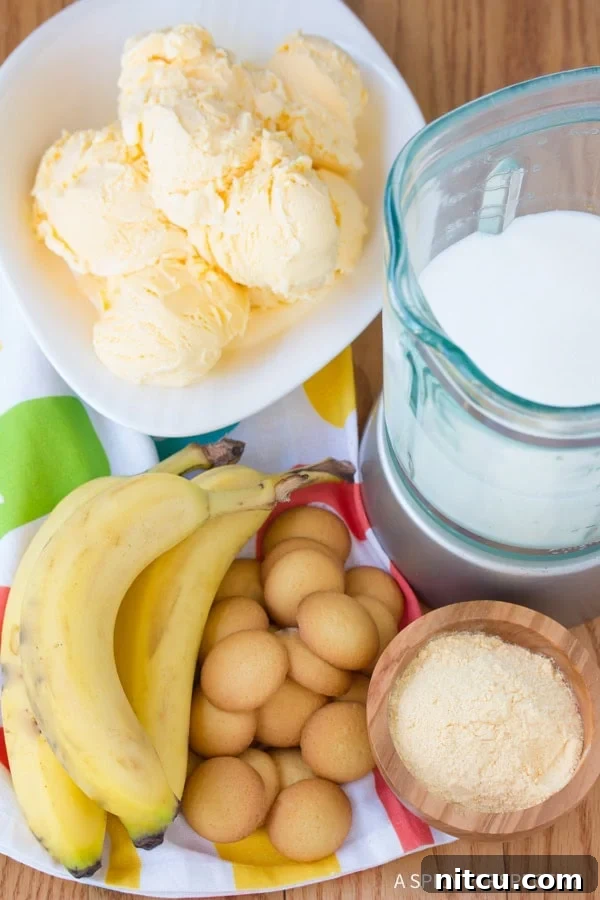 Velvet Banana Pudding Shake 3 Blender filled with ingredients for a homemade Banana Pudding Milkshake