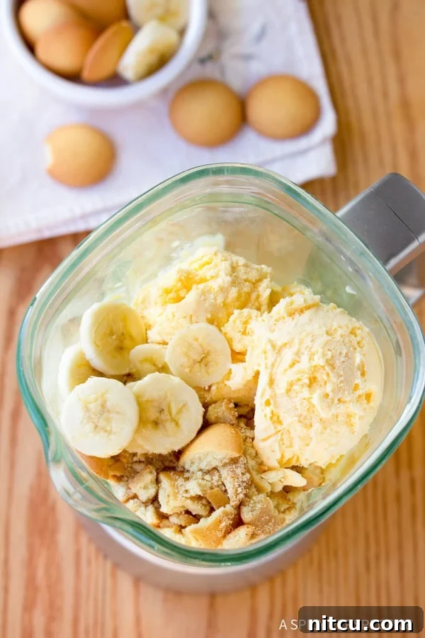 Velvet Banana Pudding Shake 4 Close-up of the Banana Pudding Milkshake blending process, showing ice cream and bananas