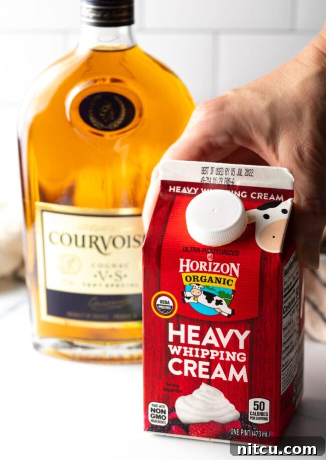 Peppercorn-Crusted Steak with Velvety Cognac Sauce 5 Container of heavy whipping cream and bottle of cognac.