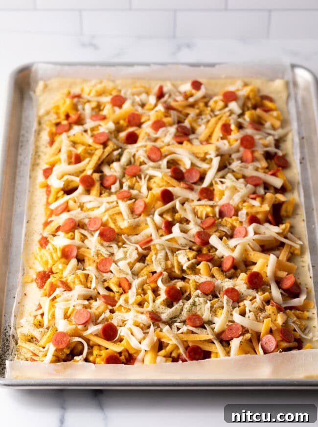 Cheesy Mac Pizza 9 Mini pepperoni slices and Italian seasoning added to the pizza before baking.