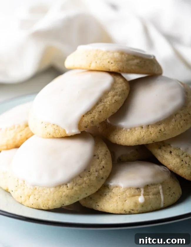 Bergamot Bliss Bites 2 EARL GREY COOKIES - Stack of soft tea cakes with lemon glaze, beautifully presented.