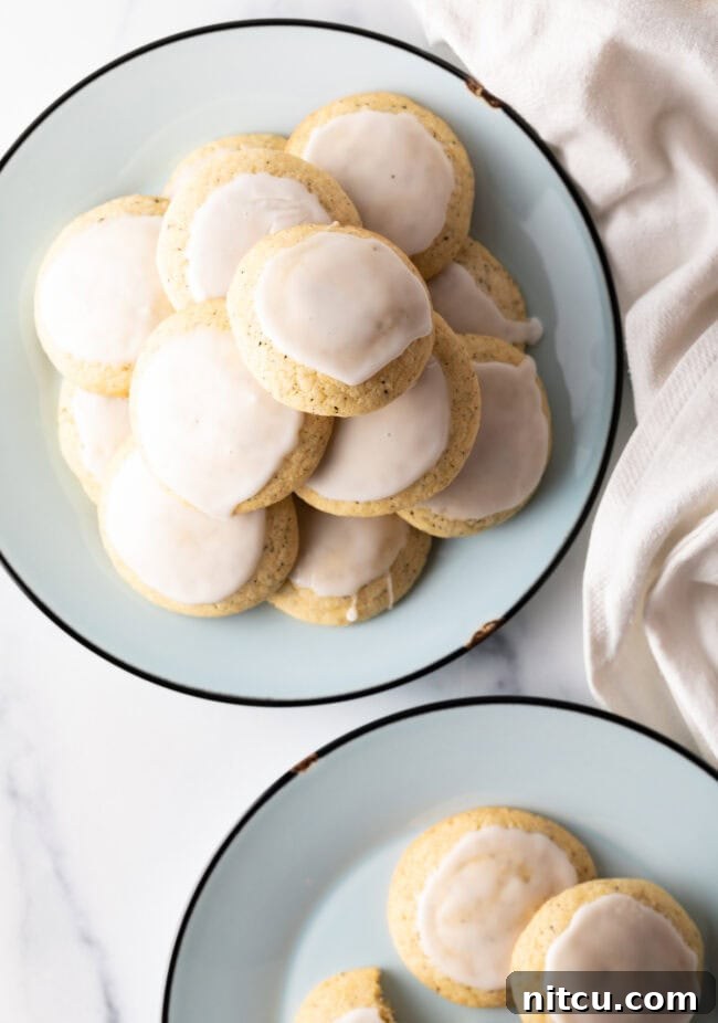 Bergamot Bliss Bites 11 Plates stacked with freshly baked Earl Grey tea cookies, each delicately finished with a lemon glaze.