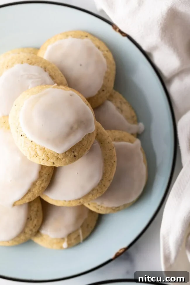 Bergamot Bliss Bites 4 Top-down view of a stack of delicate lemon glazed Earl Grey cookies, ready to be enjoyed.