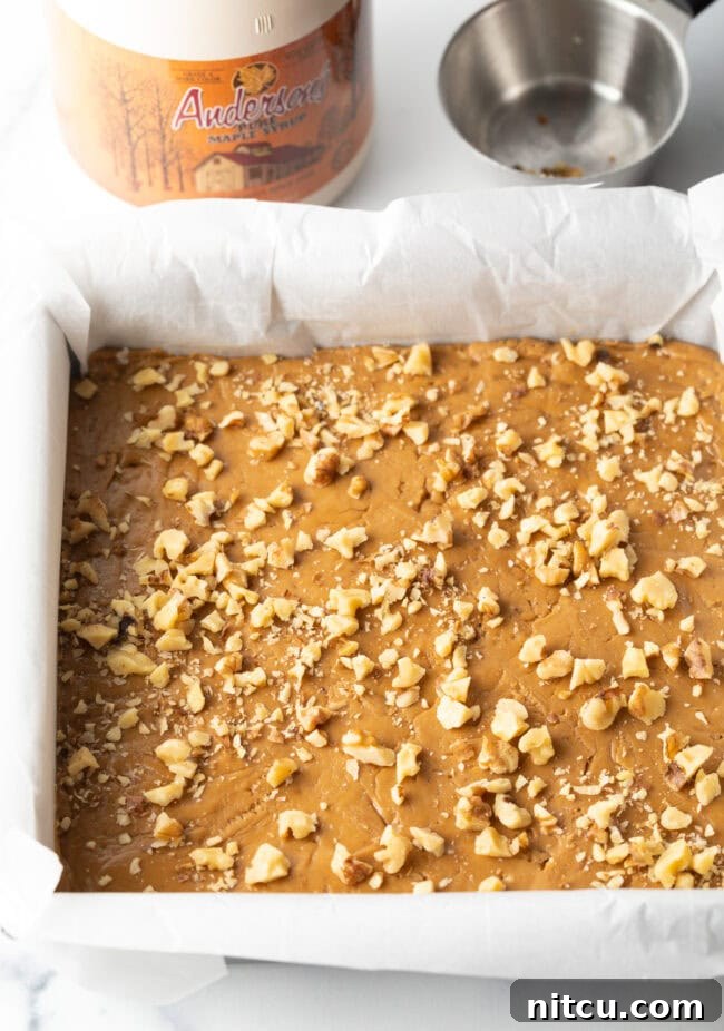 Creamy Maple Walnut Delight 10 Additional chopped walnuts artfully sprinkled over the top of the set maple fudge, adding visual appeal and extra crunch.