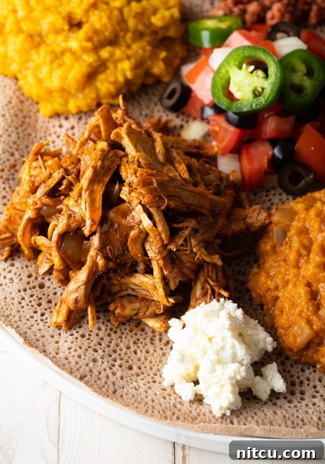 Injera topped with Ethiopian food. 