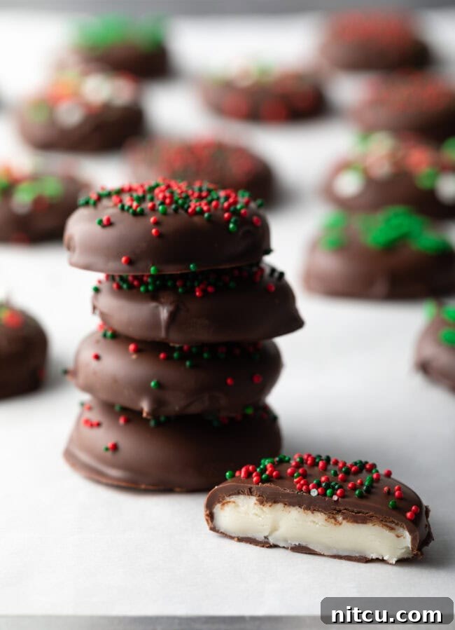 Refreshing Homemade Peppermint Delights 2 Stack of 4 peppermint patties, with 5 peppermint patty bitten in half to show insides.