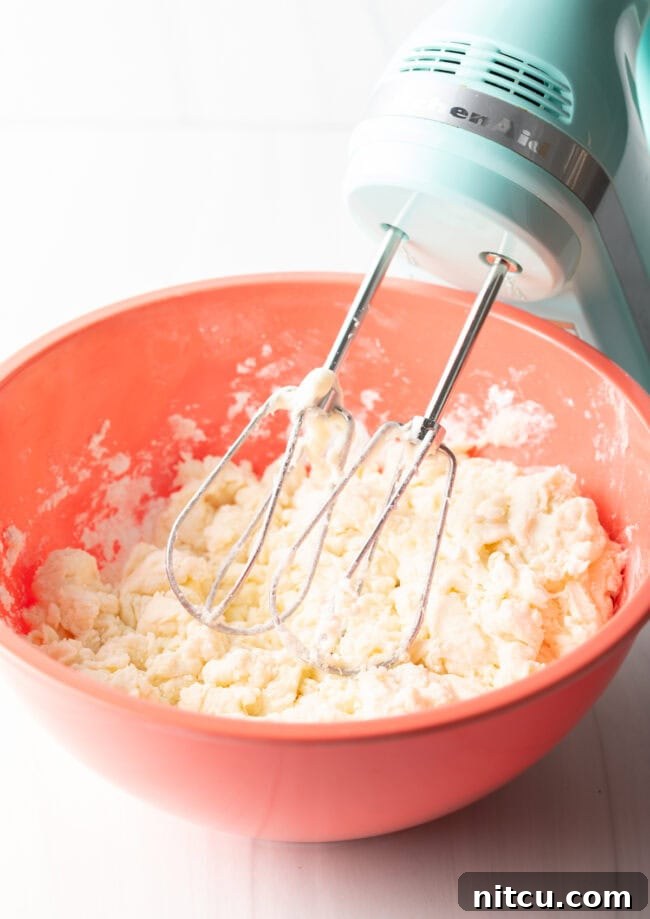 Refreshing Homemade Peppermint Delights 5 Hand electric mixer and large mixing bowl with ingredients.