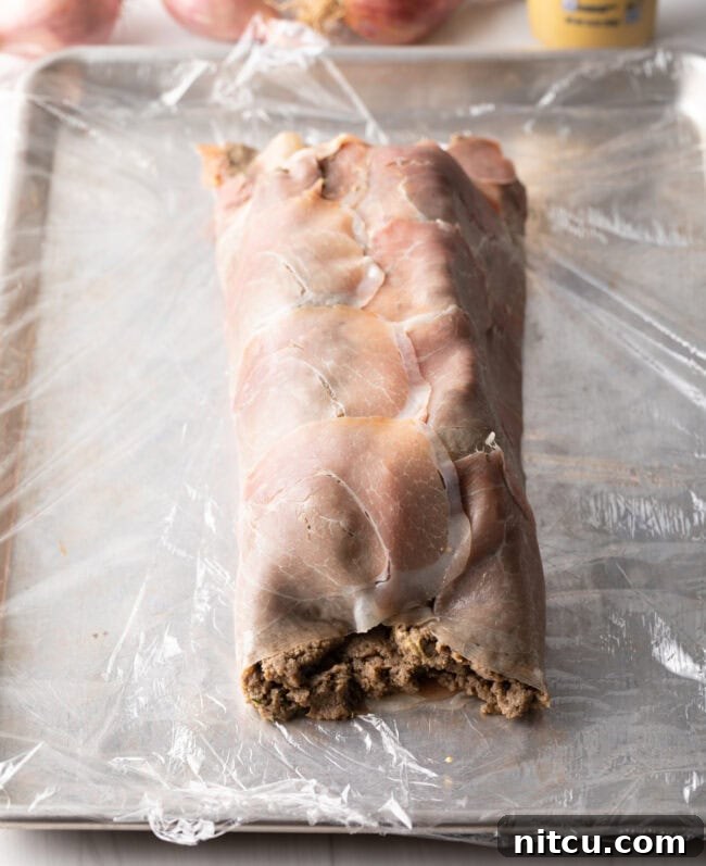 Fully wrapped beef tenderloin.