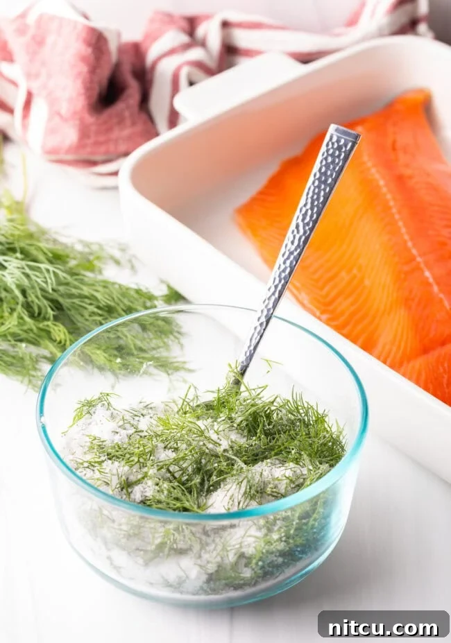 Homemade Gravlax Cured Salmon 6 Dill, salt and sugar combined in a small glass bowl, showcasing the curing mixture.