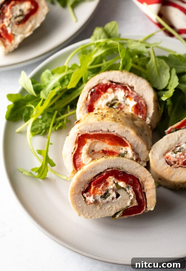 Savory Stuffed Chicken Rolls 14 Beautifully plated chicken roulade, ready for serving.