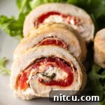A finished, sliced chicken roulade showing the inner spiral.