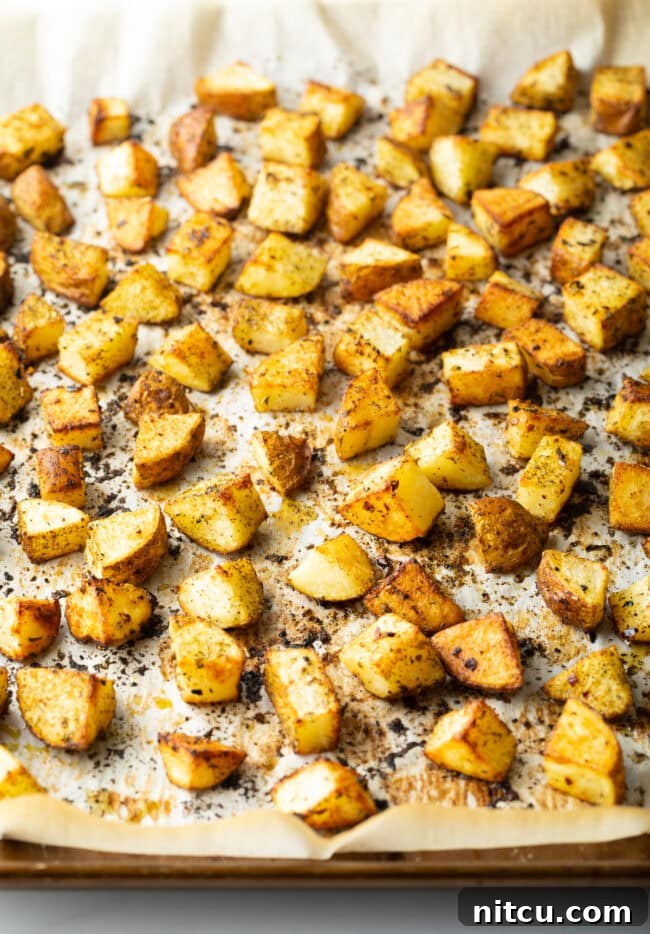 Russet Potatoes Ultimate Recipe and Cooking Tips 4 Russet Potato Recipe - Chopped baked russet potatoes on a baking sheet.