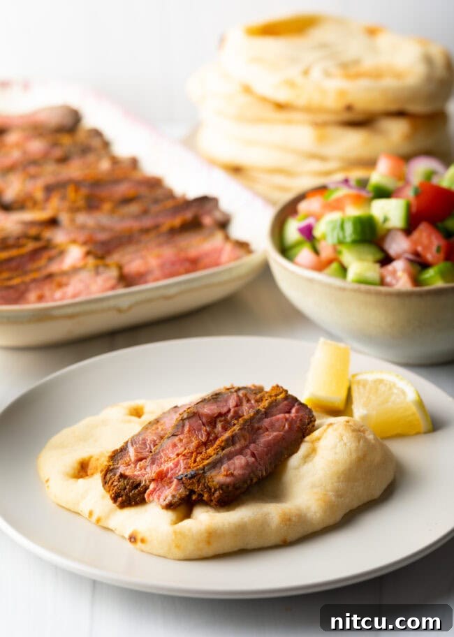 Authentic Street Style Beef Shawarma 11 Flatbread on plate with slices of beef.