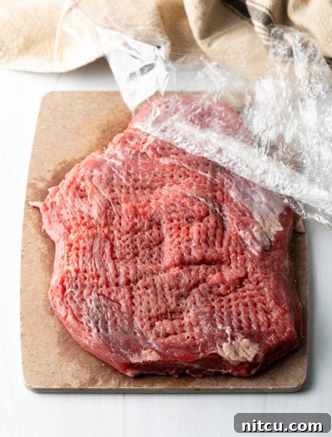 Authentic Street Style Beef Shawarma 5 Large piece of flank steak with plastic wrap, pounded thin with a mallet.