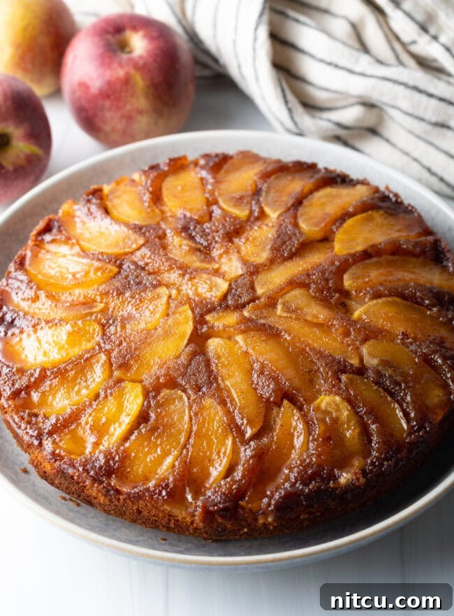Effortless Apple Caramel Flip Cake 8 Apple upside down cake on a platter.