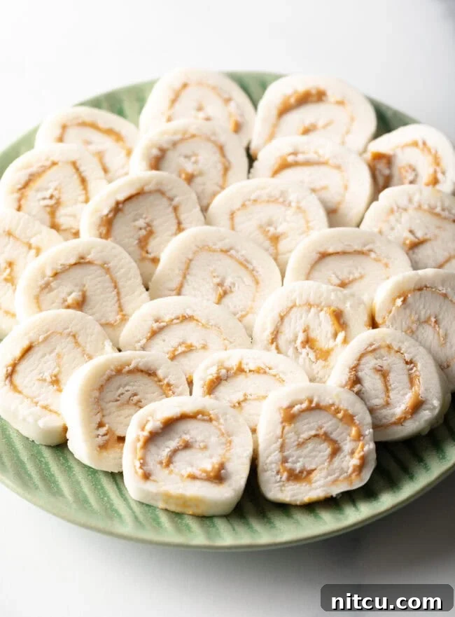 Spudnut Delights 2 Potato Peanut Butter Candy - Green plate filled with round peanut butter potato candy slices.