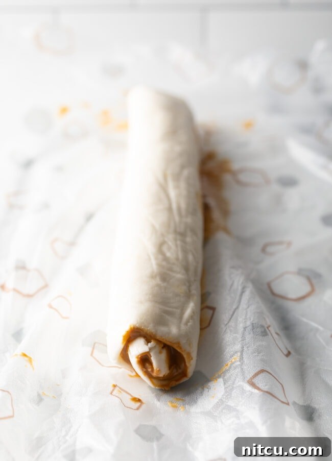 Spudnut Delights 11 Round log of rolled mashed potato candy and peanut butter.