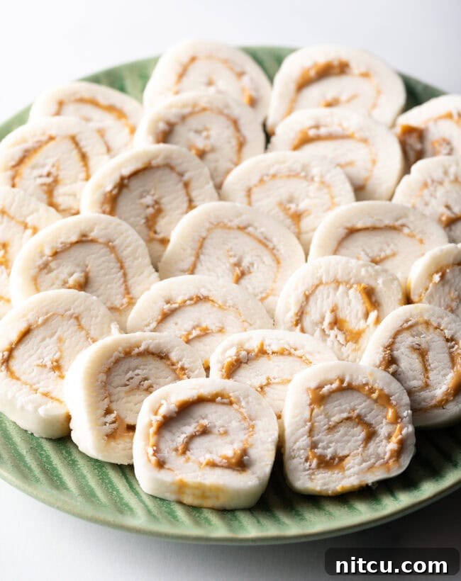 Spudnut Delights 12 Green plate filled with round peanut butter potato candy slices.