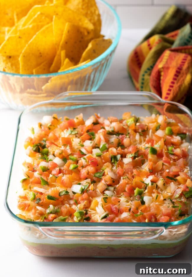 Fiesta Bean Stack 9 Glass square baking dish with layered dip.
