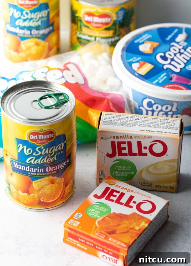 Zesty Orange Ambrosia 5 Ingredients you need for Orange Fluff: Can of mandarin orange slices, box of jello pudding and jello gelatin, container of cool whip, bag of mini marshmallows.