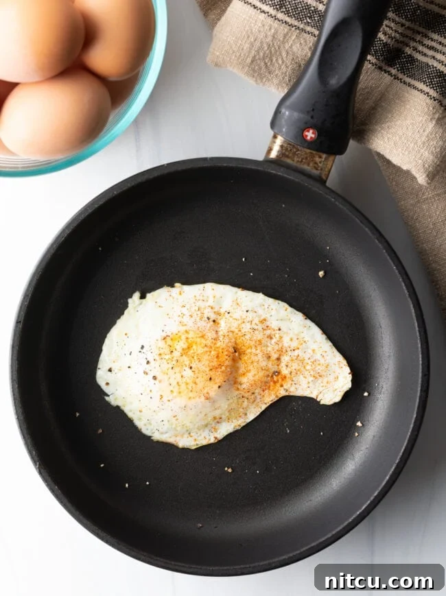 Mastering Over Easy Eggs 11 Cooked over easy egg with spices.