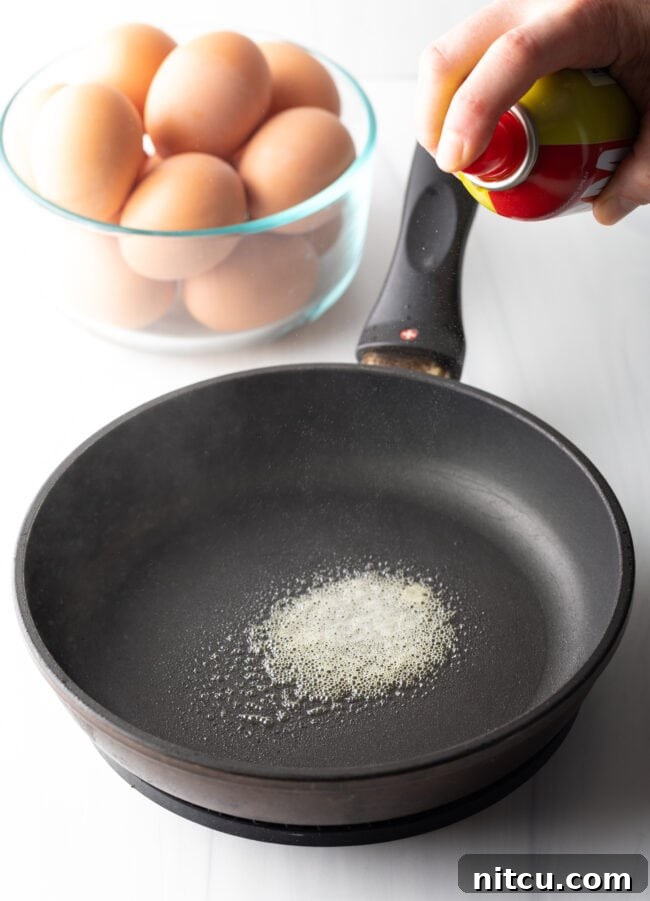 Mastering Over Easy Eggs 6 Butter melted in a large black skillet.