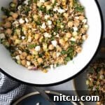 Jennifer Aniston's Go-To Bulgur Salad 12 Large white bowl filled with bulgur wheat, veggies, and feta salad.