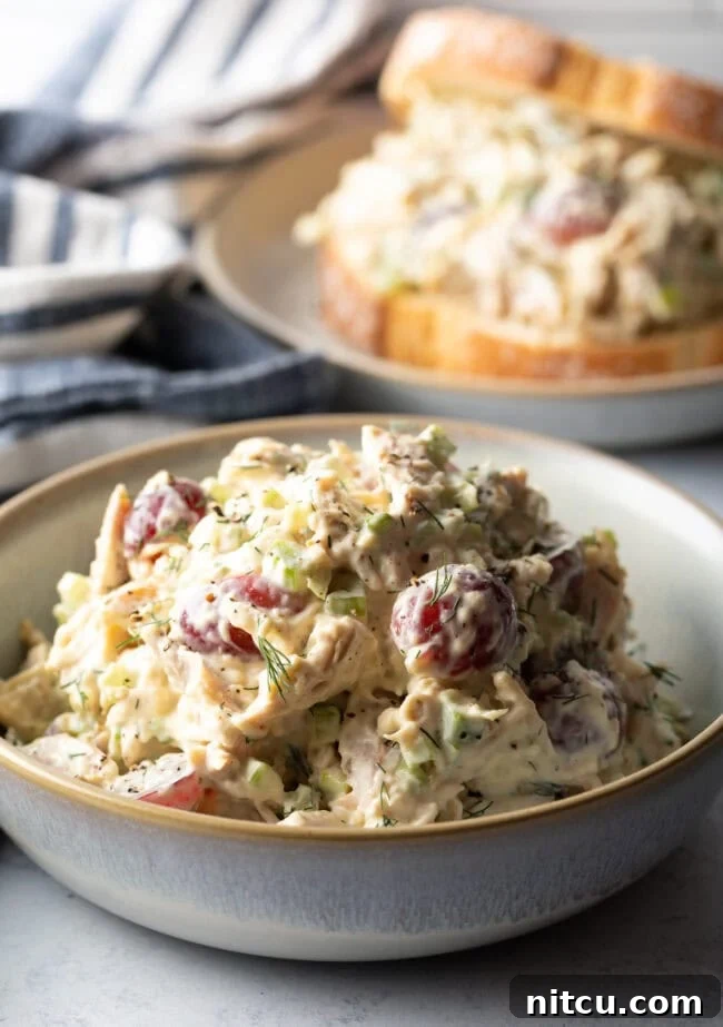 Perfect Turkey Sandwich Salad 2 White bowl loaded up with turkey salad. Main shot of leftover turkey recipe post.
