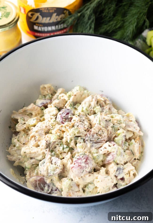 Perfect Turkey Sandwich Salad 8 All ingredients for leftover turkey salad combined in white bowl.