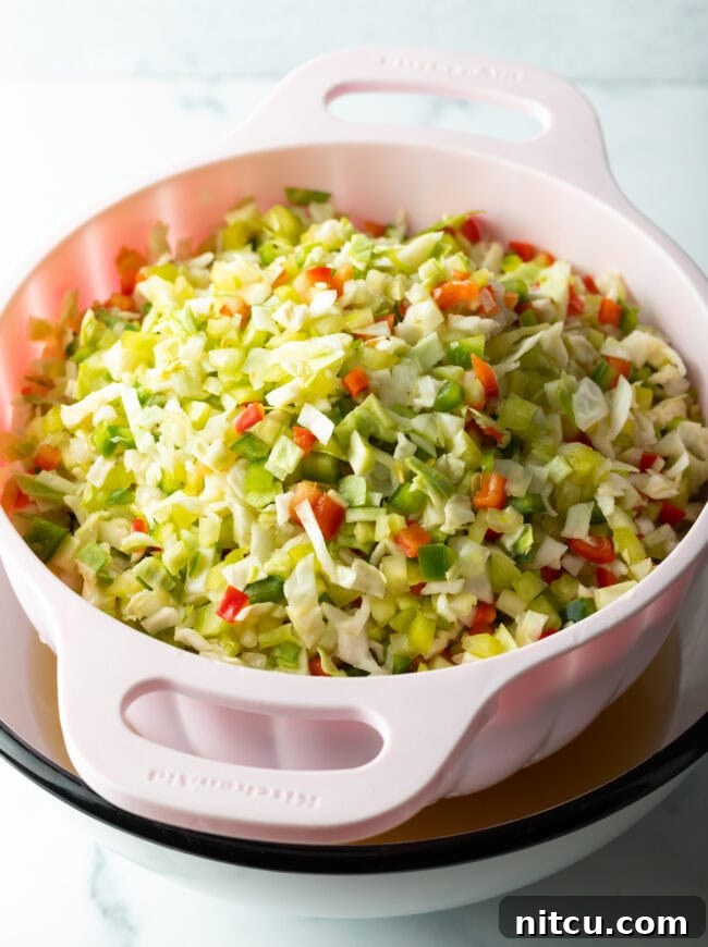 Tangy Homemade Chow Chow 7 Chopped fresh veggies in a colander.