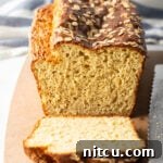 Loaf of bread, one piece sliced to show inside of the loaf.