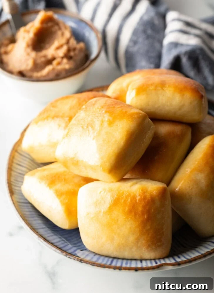 Stack of rectangle Texas Roadhouse rolls.