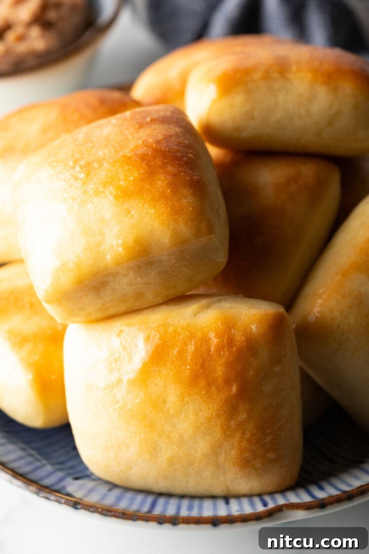 Stack of rectangle Texas Roadhouse rolls.
