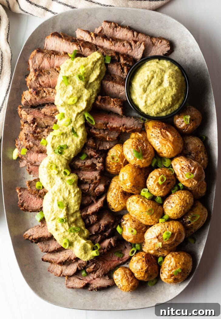 Signature London Broil Marinade 4 London Broil Marinade - London broil sliced into thick strips, covered with rich green sauce and chopped scallions with baby potatoes on the side.