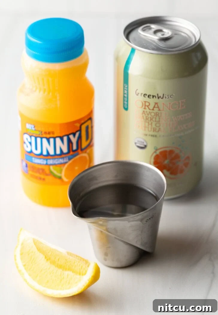Sunny D Zest Seltzer 4 Recipe ingredients: Bottle of juice, metal cup with vodka, fresh orange wedge, and can of soda.
