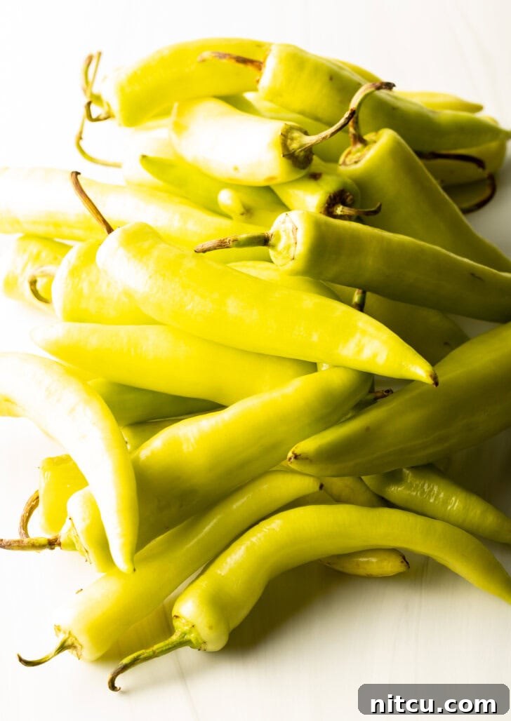 Sweet and Tangy Pickled Banana Peppers 5 Pile of raw yellow banana peppers.