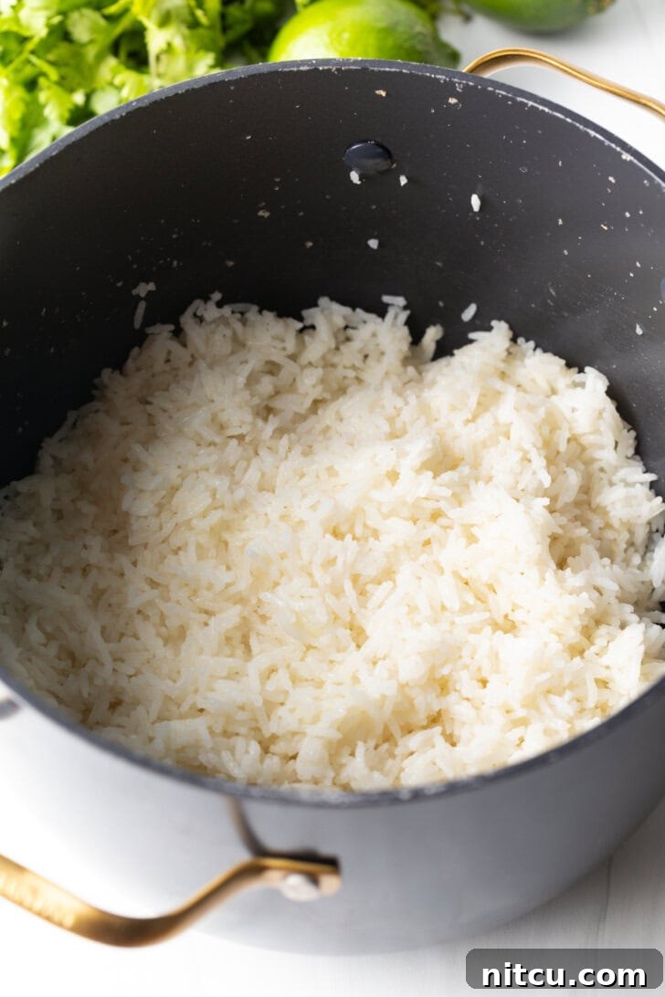 Homemade Chipotle Cilantro Lime Rice 6 Pot of cooked white rice.