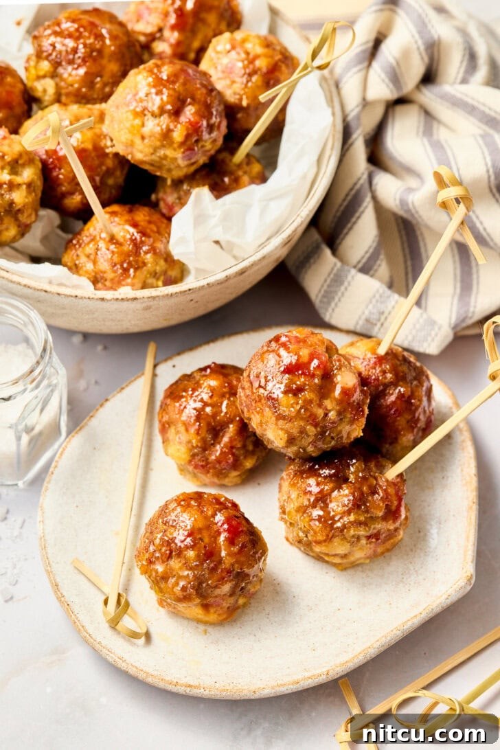 Spiced Apple Swedish Meatballs Recipe | ASpicyPerspective.com #recipes #apple Apple Butter Meatballs - Gluten Free Meatballs with Apple Glaze on plate