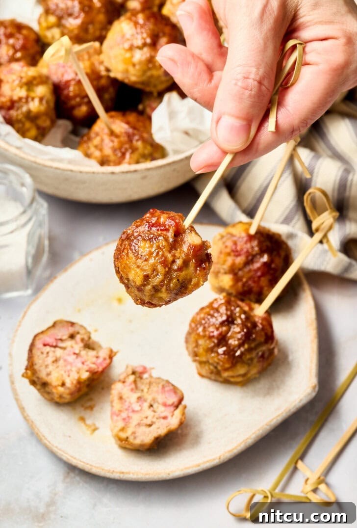 Spiced Apple Swedish Meatballs Recipe | ASpicyPerspective.com Apple Butter Meatballs on toothpick