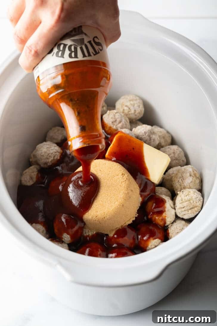 Sweet & Smoky Slow Cooker Meatballs 6 Crockpot filled with frozen meatballs, a stick of butter, scoop of brown sugar, and pouring in a bottle of bbq sauce.