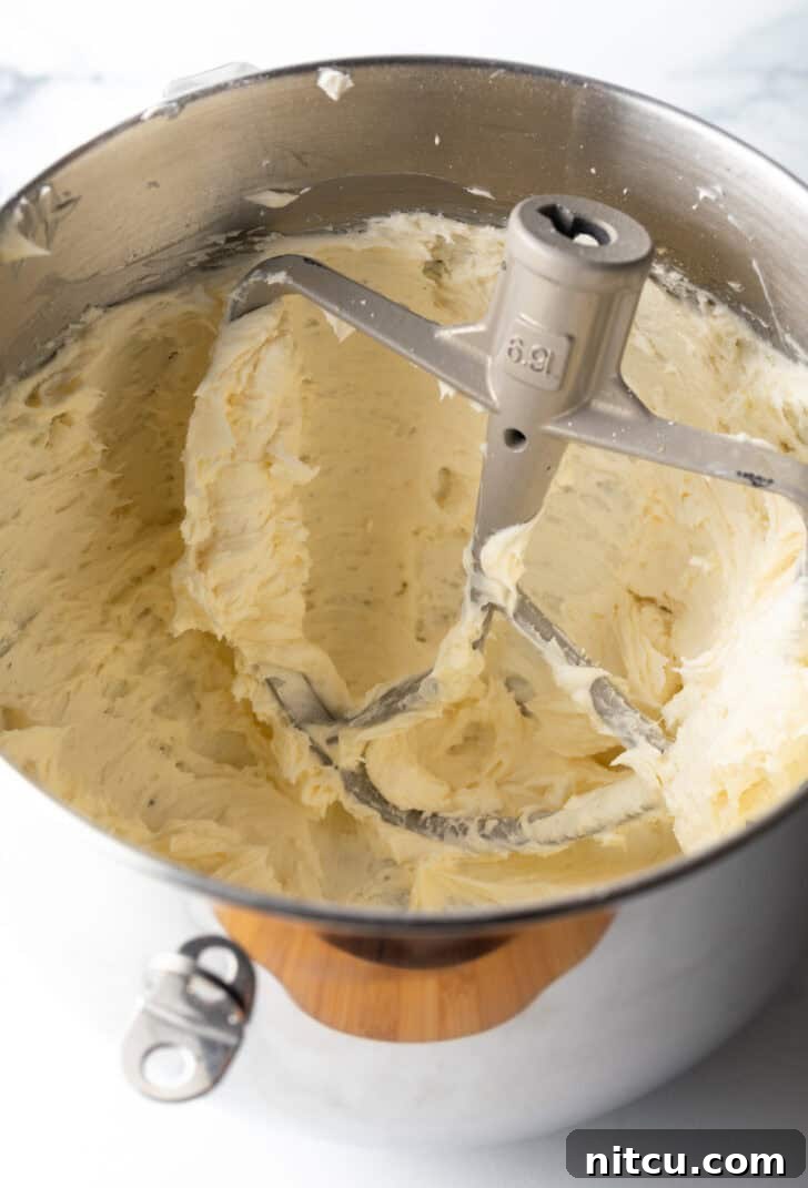 Honey Butter Cornbread Delights 8 Cornbread cookie dough in a metal standing mixer bowl.