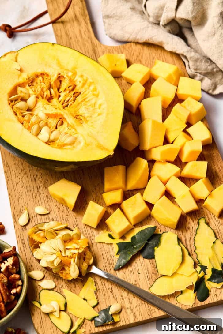 roasted pecans Uncooked butternut squash and other fresh ingredients arranged for the recipe.