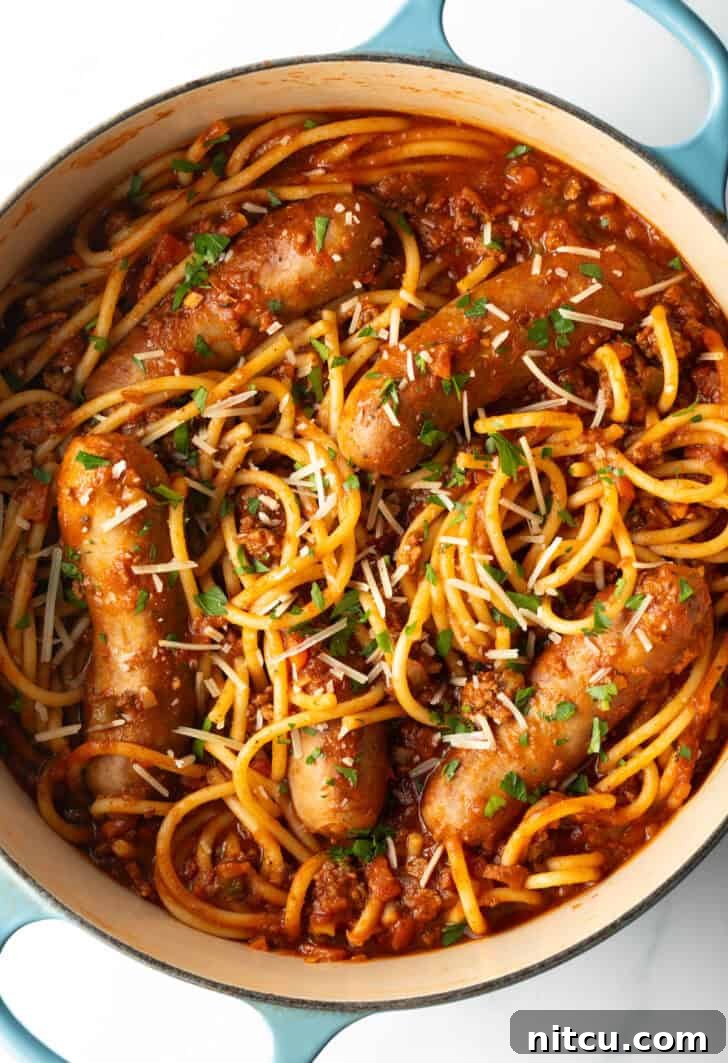 Slow-Simmered Sunday Meat Sauce 4 Top down one pot of spaghetti, sausage, and tomato sauce.