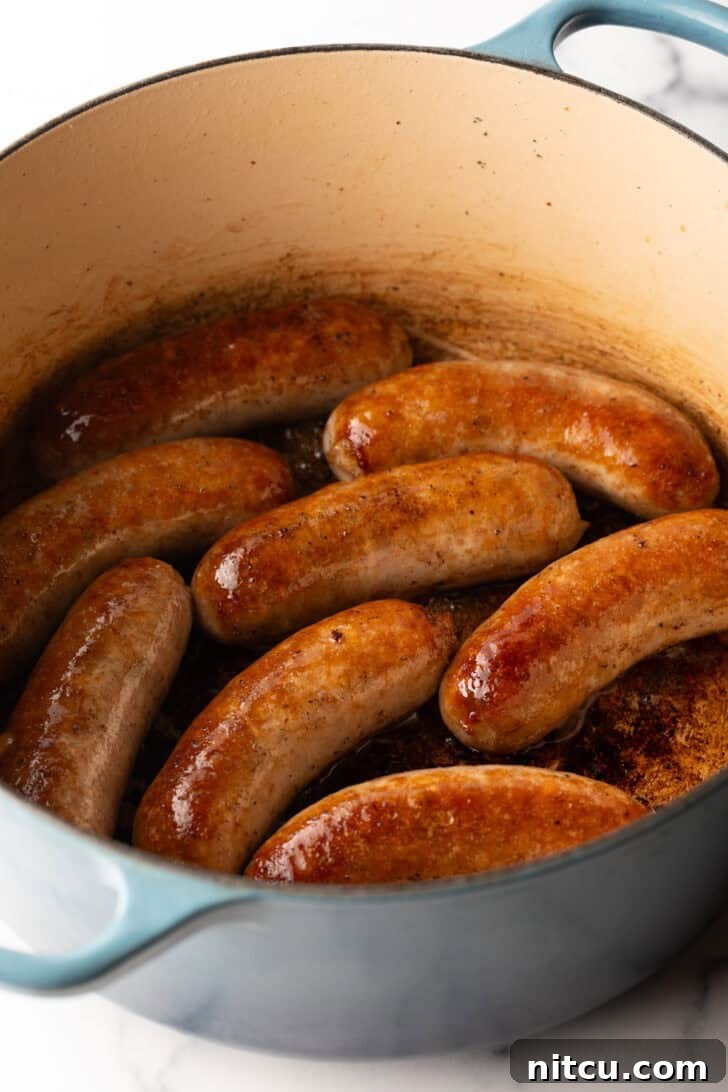 Slow-Simmered Sunday Meat Sauce 5 Large cooking pot with 8 seared Italian sausages.