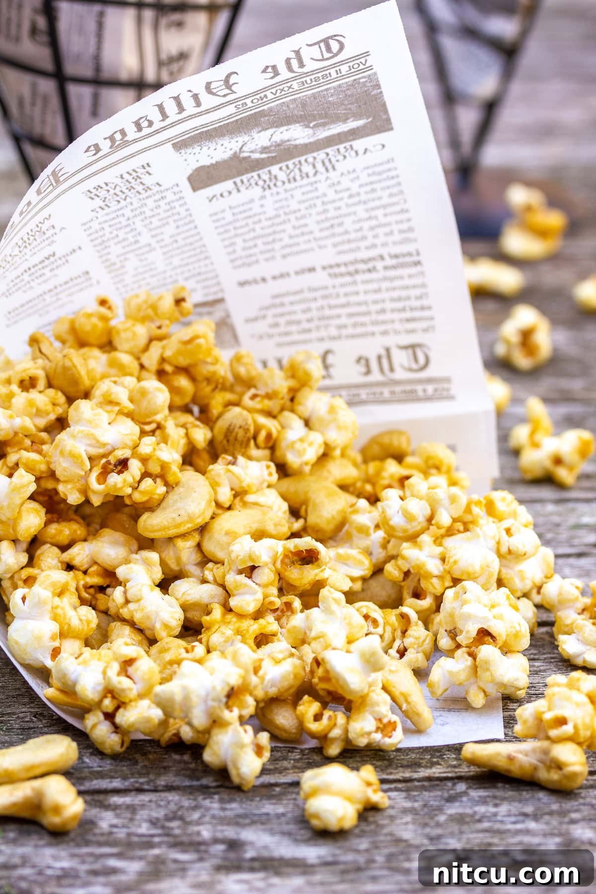 Caramel Corn with Cashews A close-up of microwave caramel corn studded with crunchy cashews, highlighting the perfect, glossy caramel coating.
