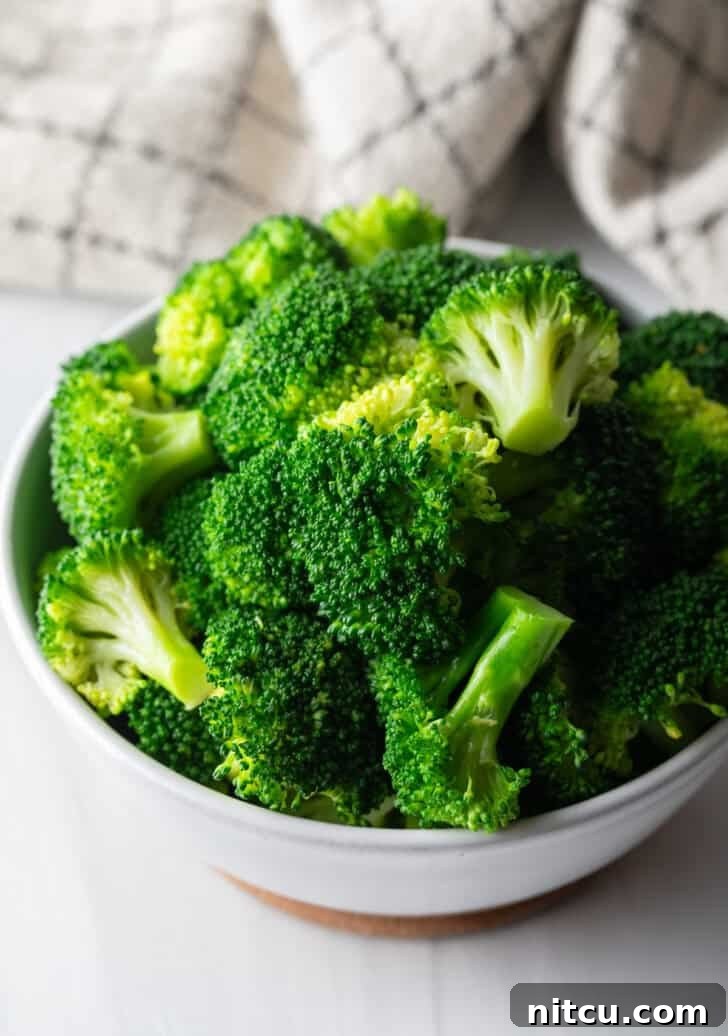 Achieve Perfectly Tender Broccoli Every Time 2 Cooked broccoli on the stovetop, vibrant green and ready to serve