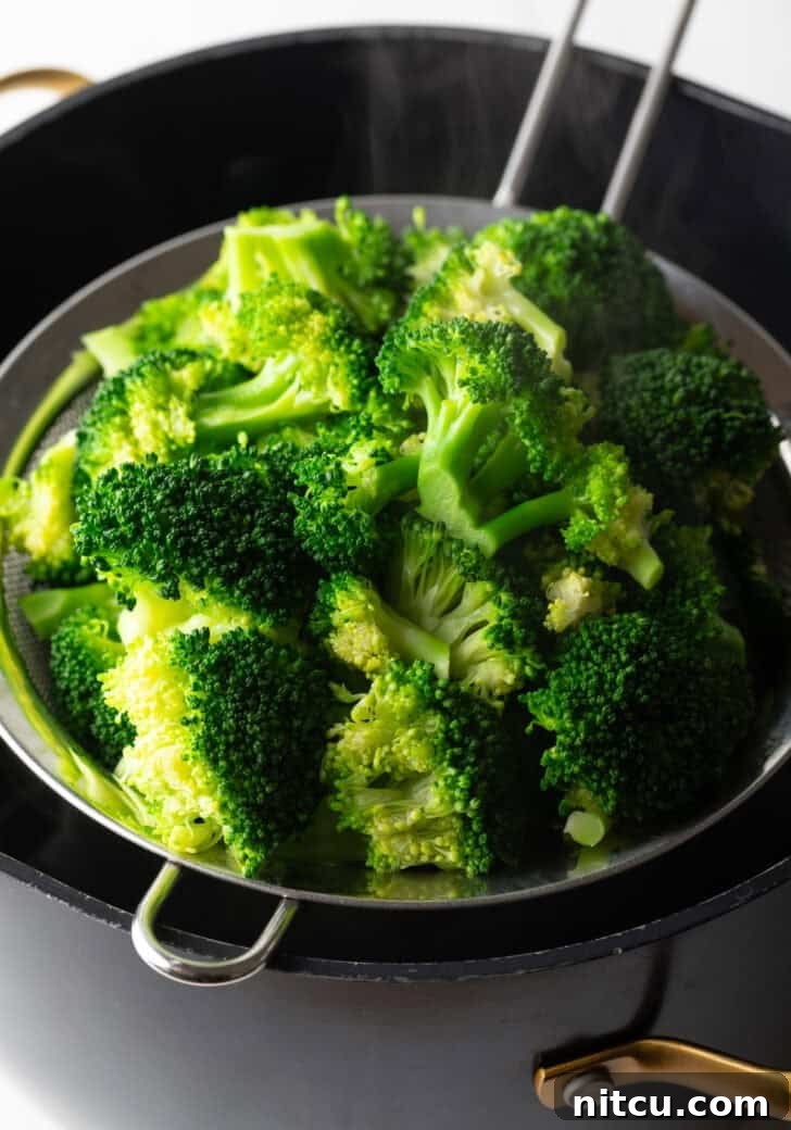 Achieve Perfectly Tender Broccoli Every Time 6 strain cooked broccoli in seive